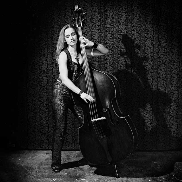 Beautiful woman playing an upright bass