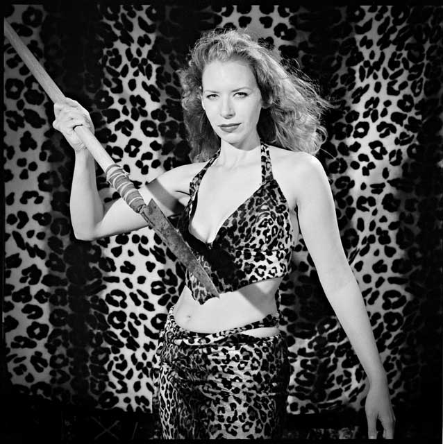 Woman in a leopard print bikini wielding a spear