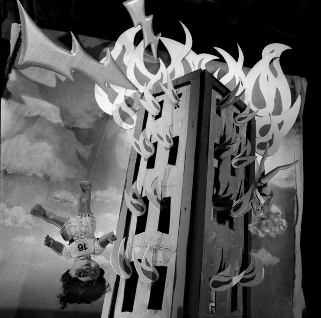 Figures plummeting from the heights of a burning building