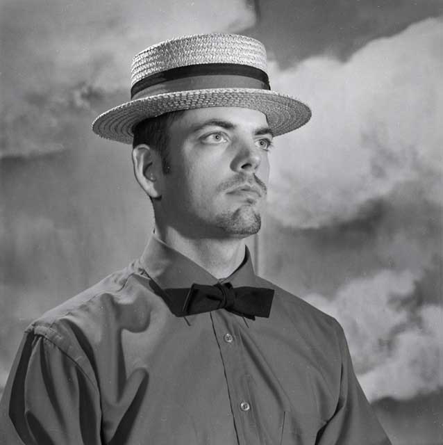 Well dressed dandy wearing a hat