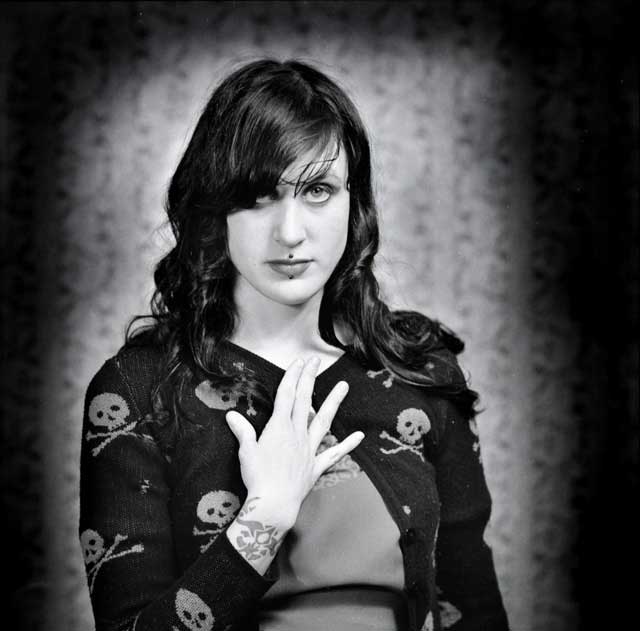 A posed portrait of a young woman; a PreRafaelite beauty